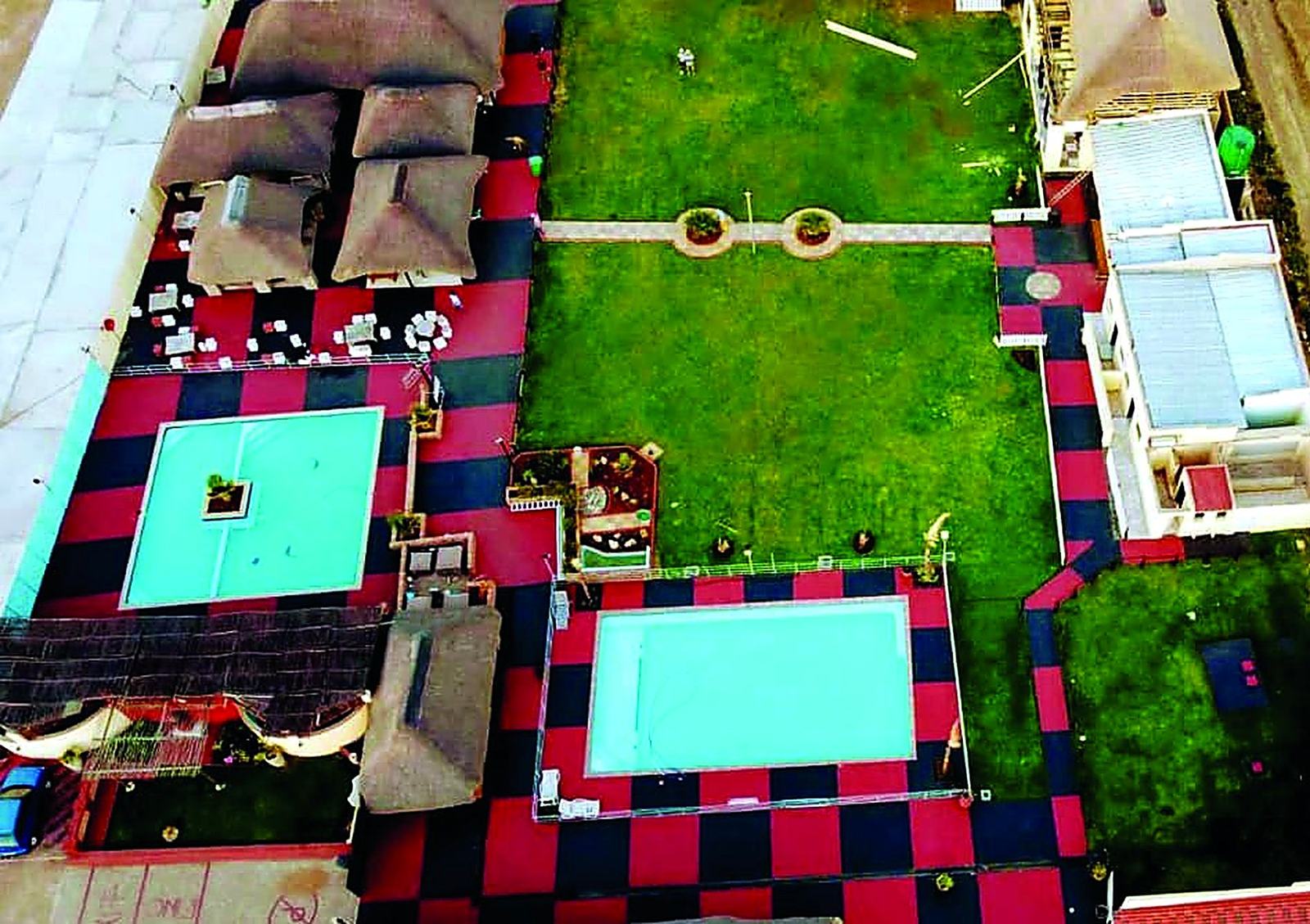 Aerial view of the pools, lawns and lounge decks at Kgalala Palace